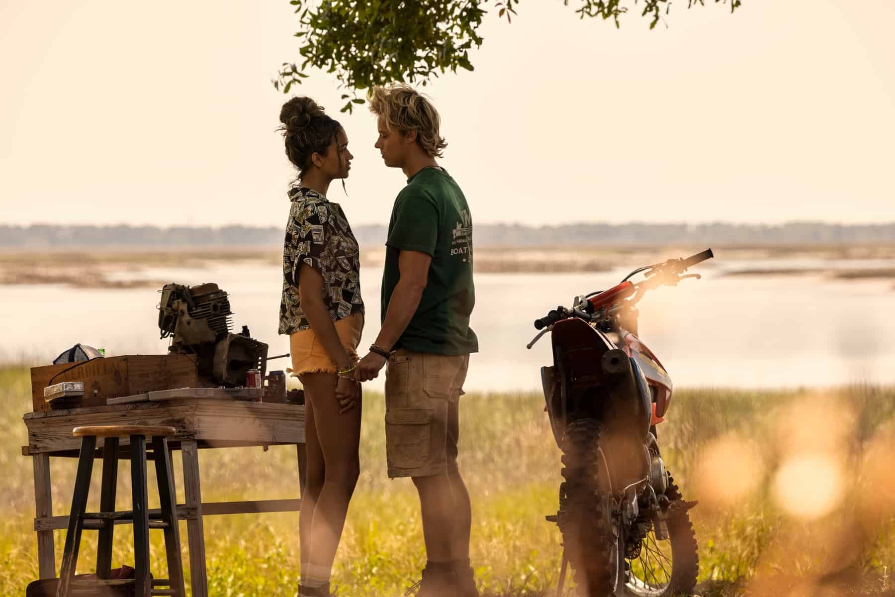 A teen couple standing close to each other in this image from Red Canoe Productions.