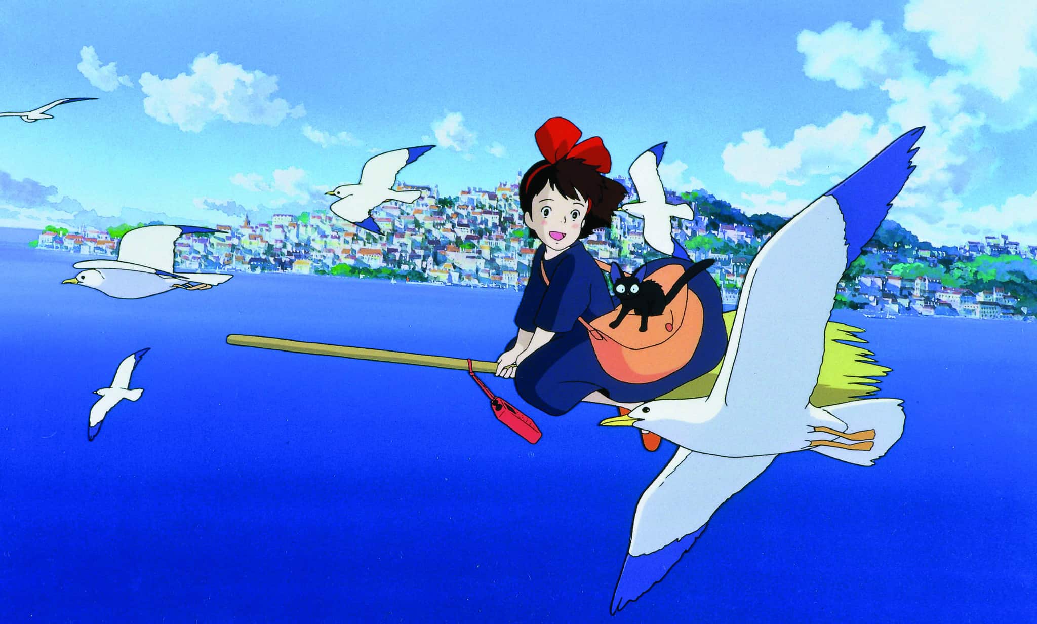 Animated girl rides a broomstick in this image from Studio Ghibli.