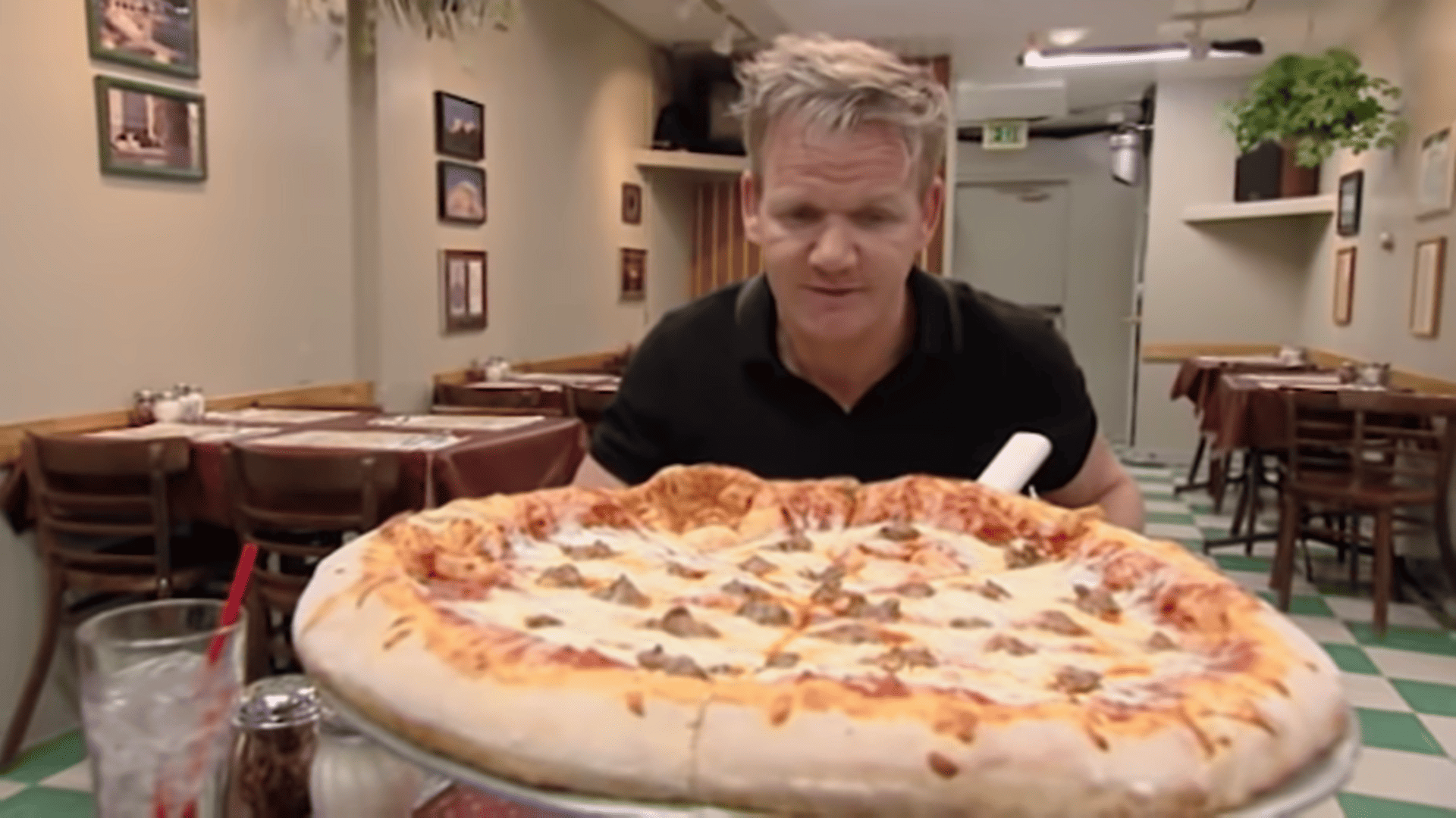 Gordon Ramsay looking at a thin-crust pizza from Pantaleone’s in this image from Studio Ramsay Global.
