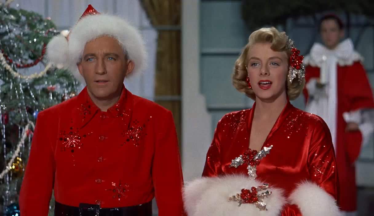A man and a woman singing while wearing Christmas attire in this image from Paramount Pictures.