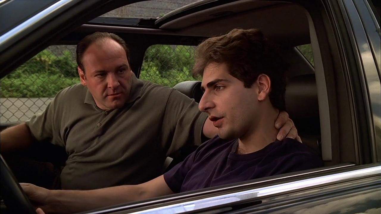 Two men talk in a car in this image from HBO Entertainment