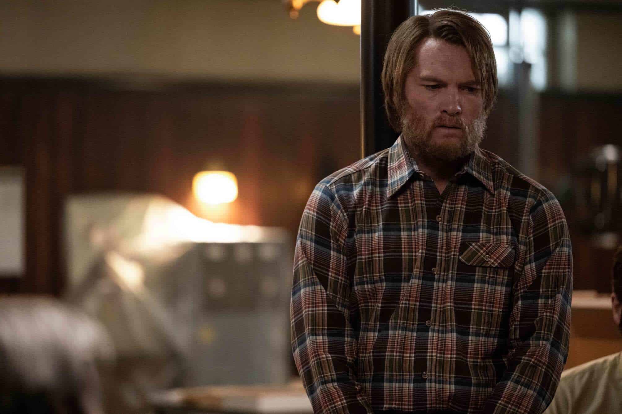 A man in a plaid button-up looks worried in this image from FX Productions.