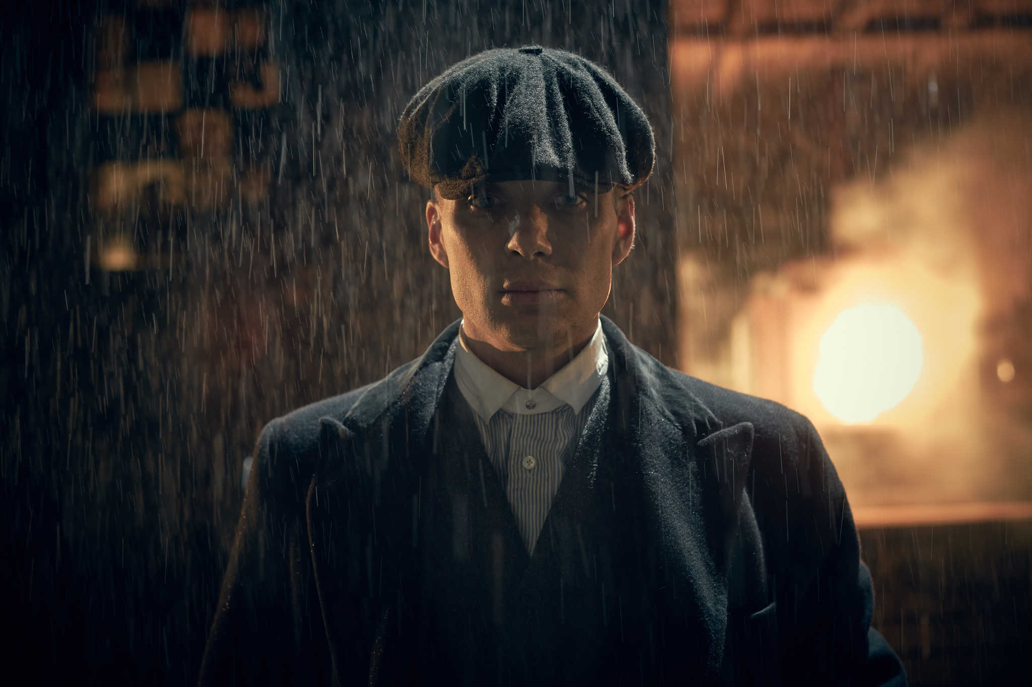 A man stands in the rain in this image from Caryn Mandabach Productions.