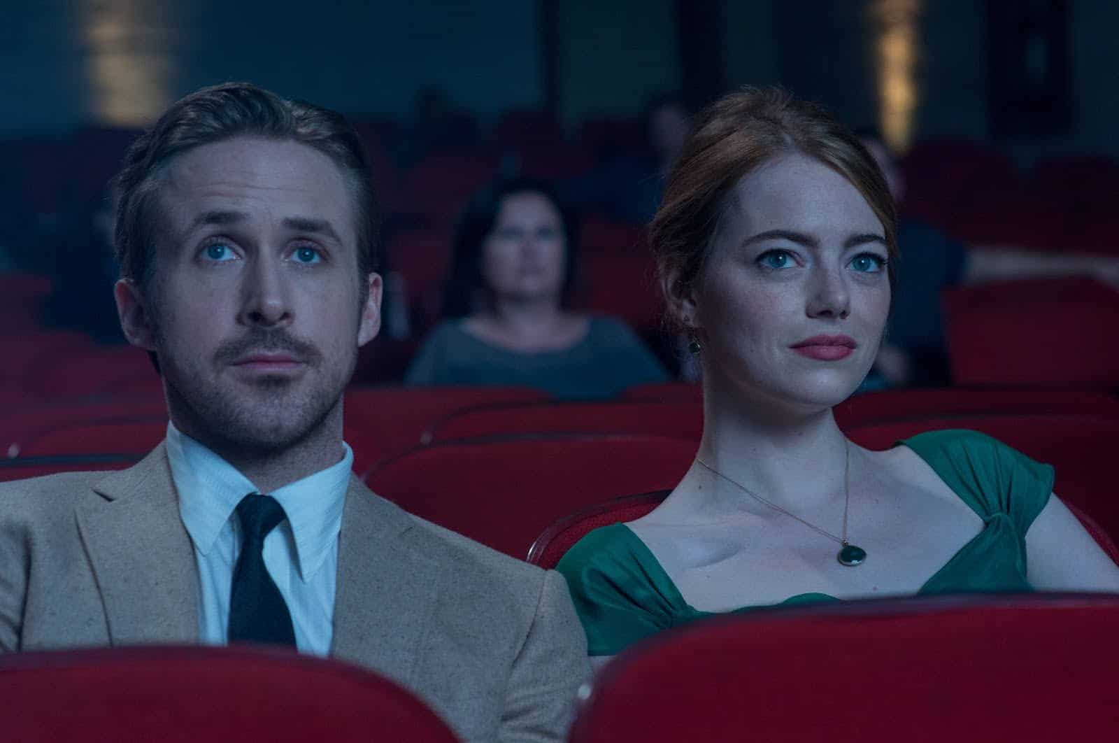 A vintage man and woman sit in a movie theater in this image from Summit Entertainment.