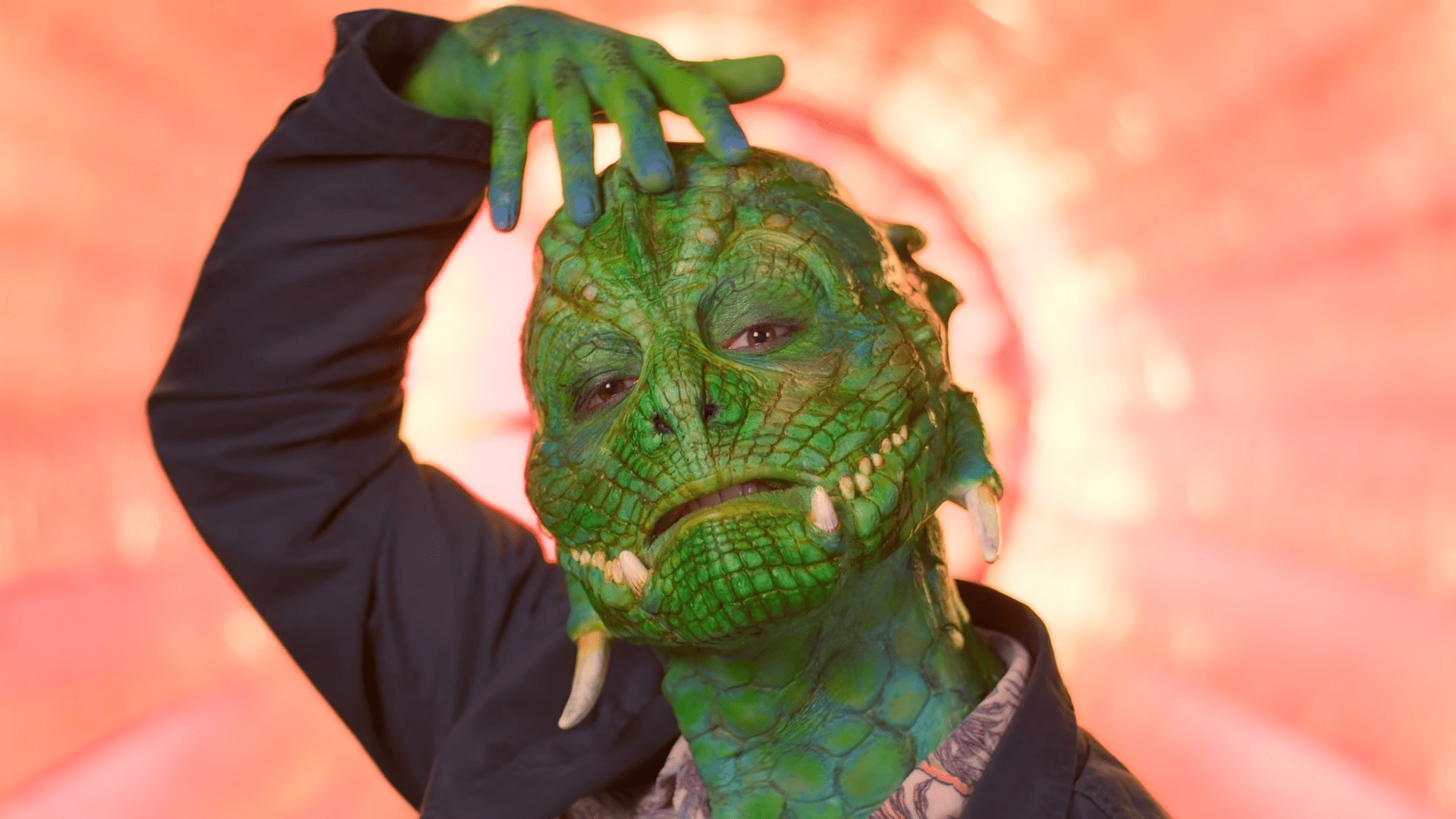A contestant wearing prosthetic makeup to look like a dragon in this image from Lion TV.