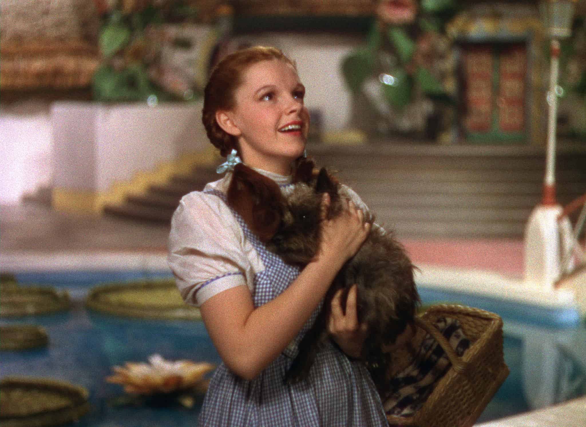 A young woman holds her dog in this image from Metro-Goldwyn-Mayer.