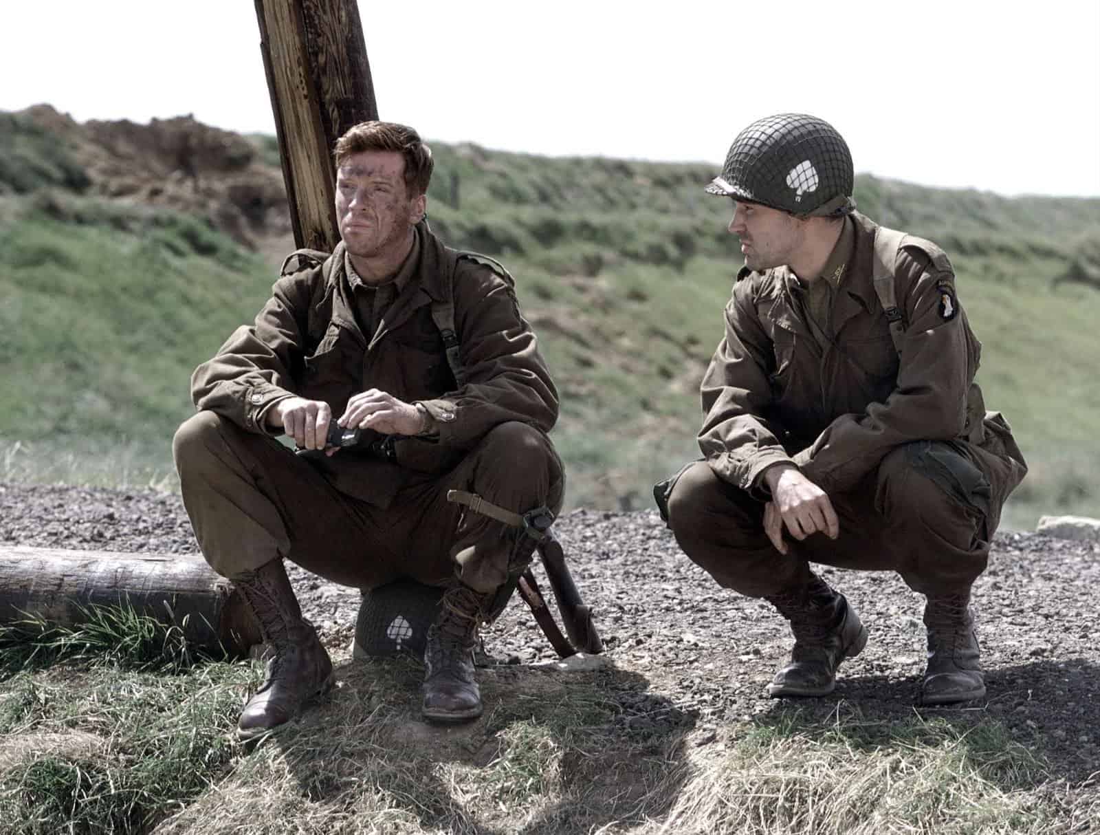 Two World War II soldiers crouch by a pole in this image from DreamWorks.