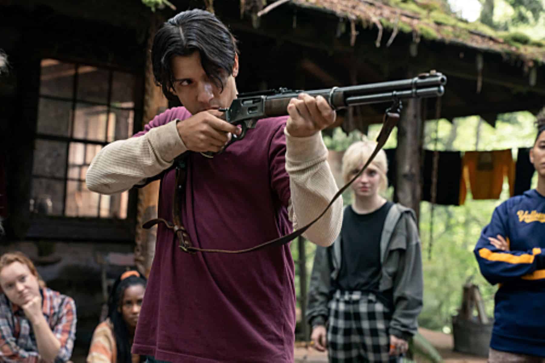 A man shoots a rifle at something offscreen in this photo by Showtime.