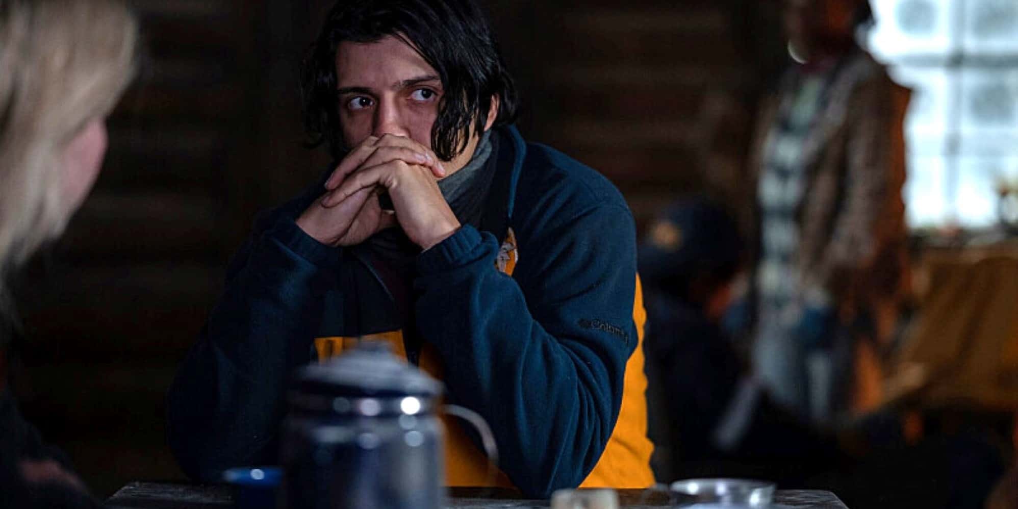 A man sits at a table with a woman slightly out of frame in this photo by Showtime.