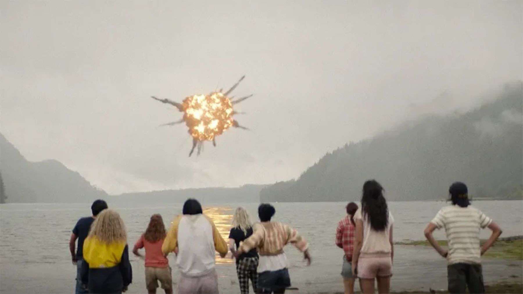 A group of teenagers view an explosion in the sky in this photo by Showtime.