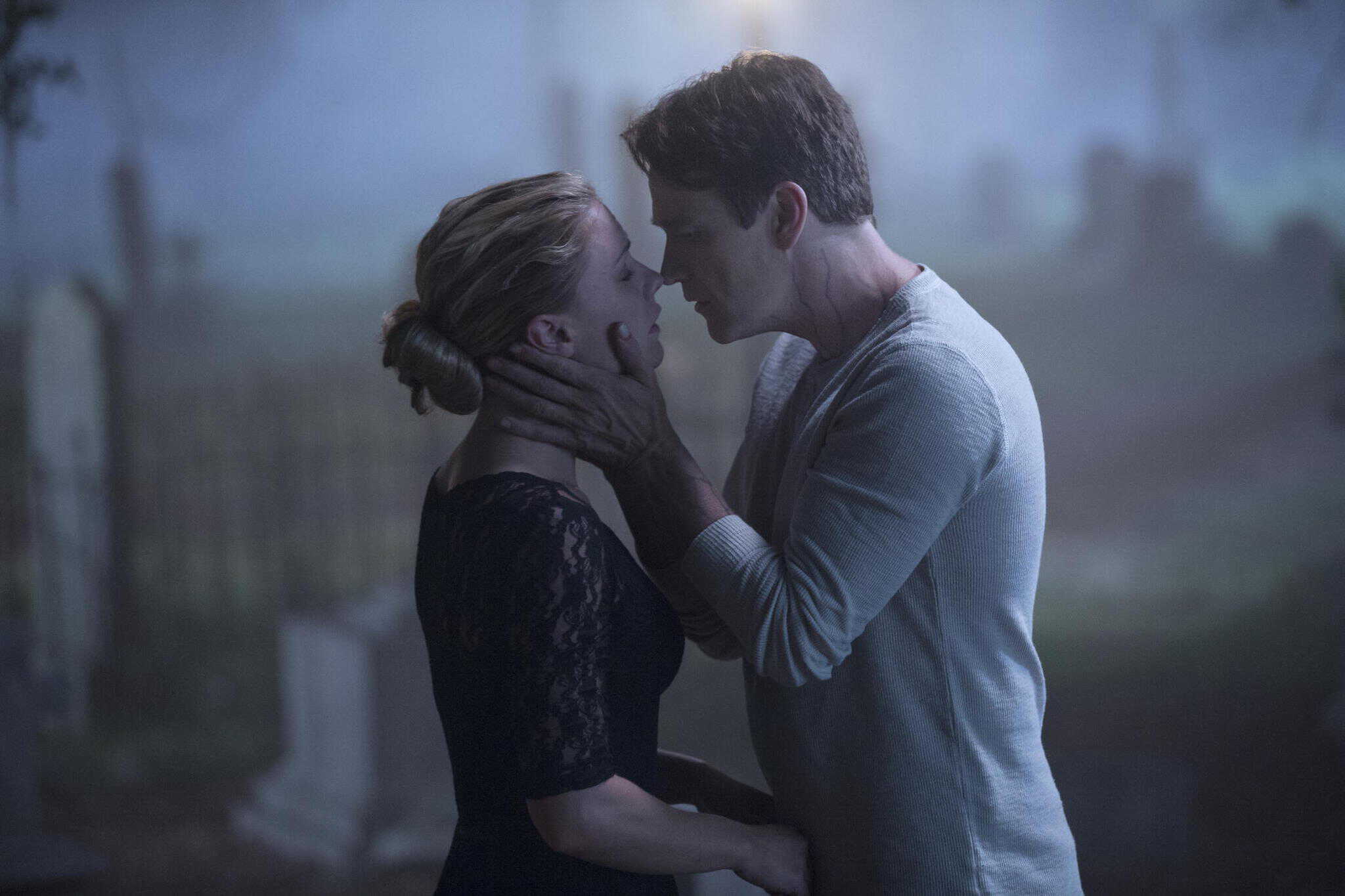 A woman and a man lean in for a kiss in this image from HBO Entertainment.