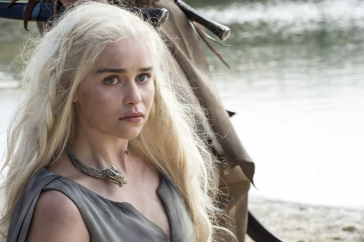 A woman with white-blonde hair stands in front of a river in this image from HBO Entertainment.