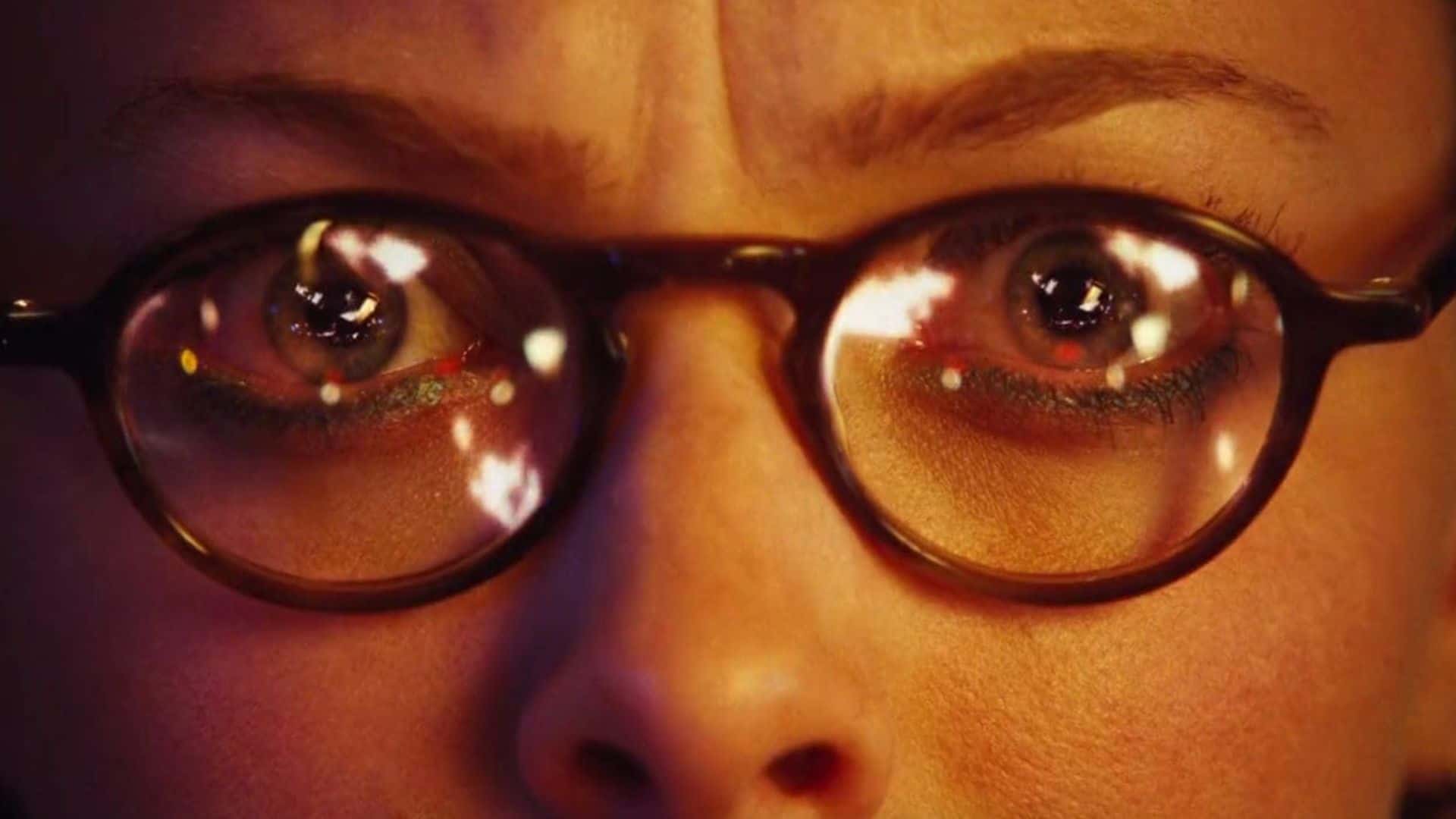 A close-up of a woman in brown glasses in this image from Fox Atomic.