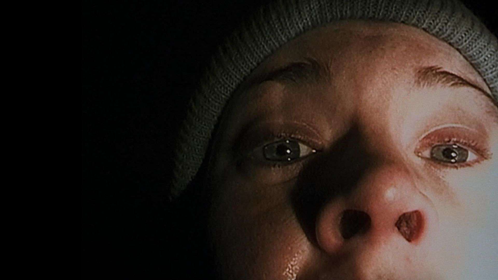A close-up of a woman crying in this image from Haxan Films
