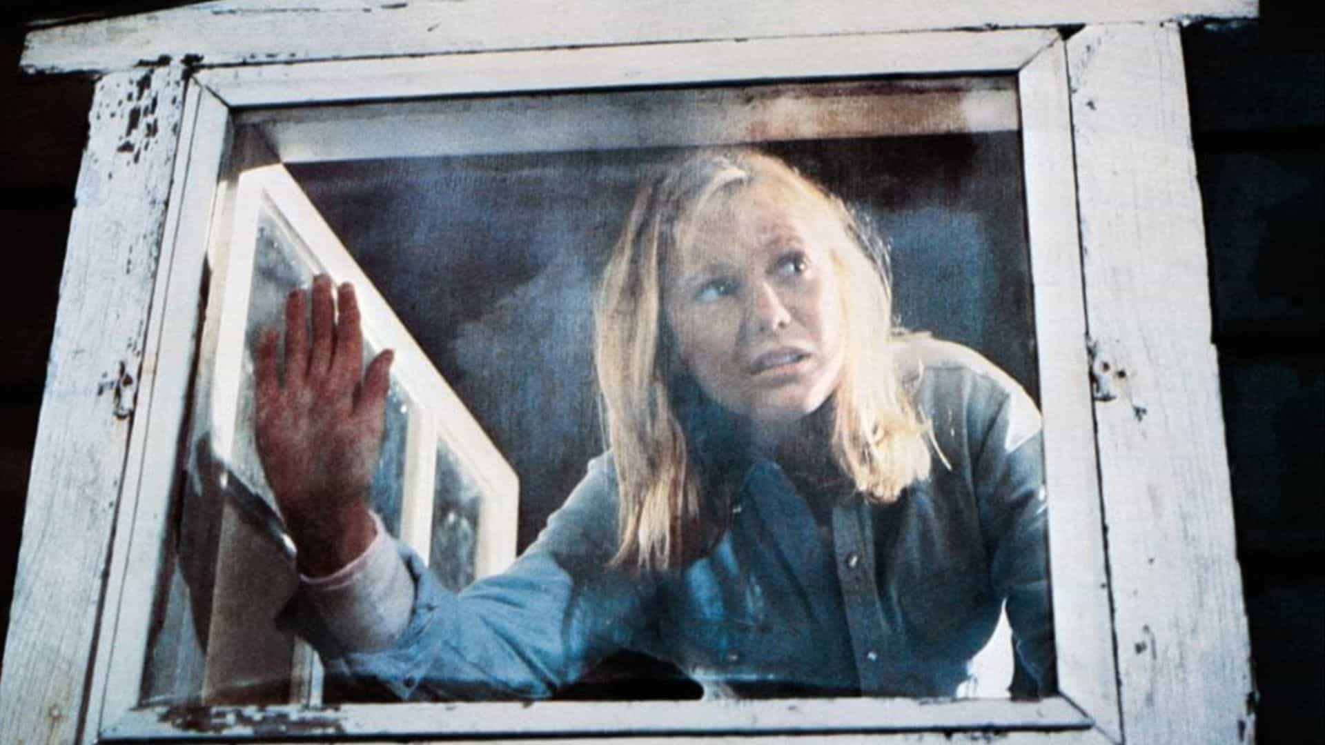  A woman presses her hand against a window in this image from Georgetown Productions Inc.