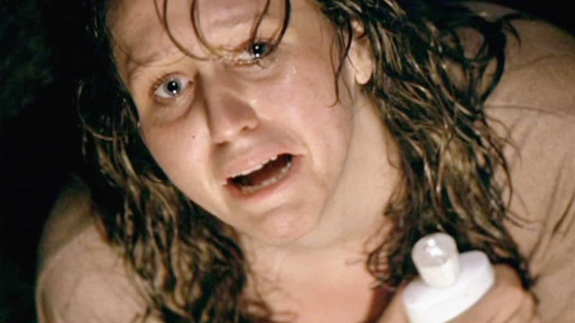 A woman holds a bottle of lotion in this image from Strong Heart Productions.