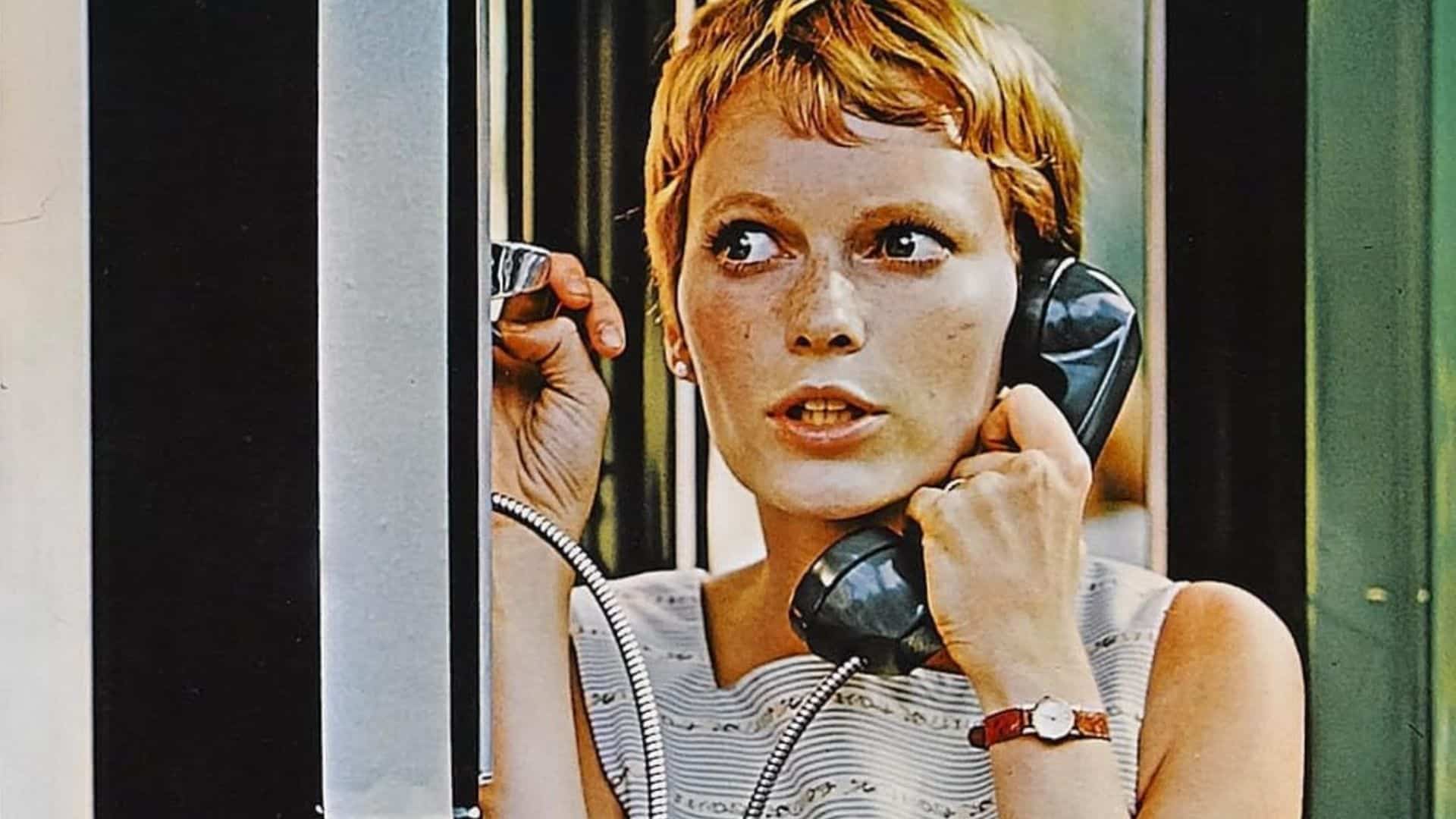 A woman talks on a pay phone in this image from William Castle Enterprises.
