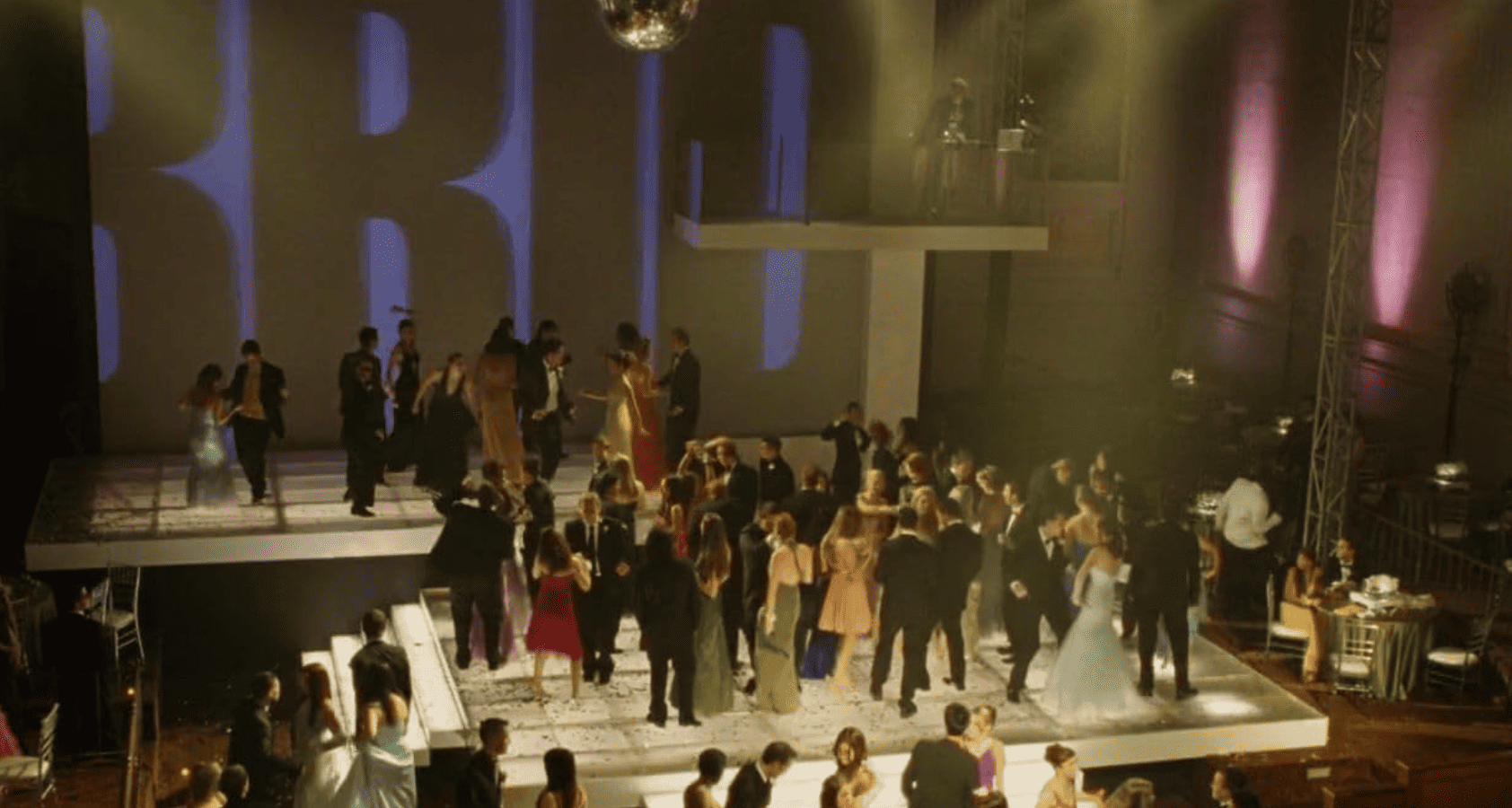 Photograph capturing a dance floor with young people scattered throughout in this image from Screen Gems.