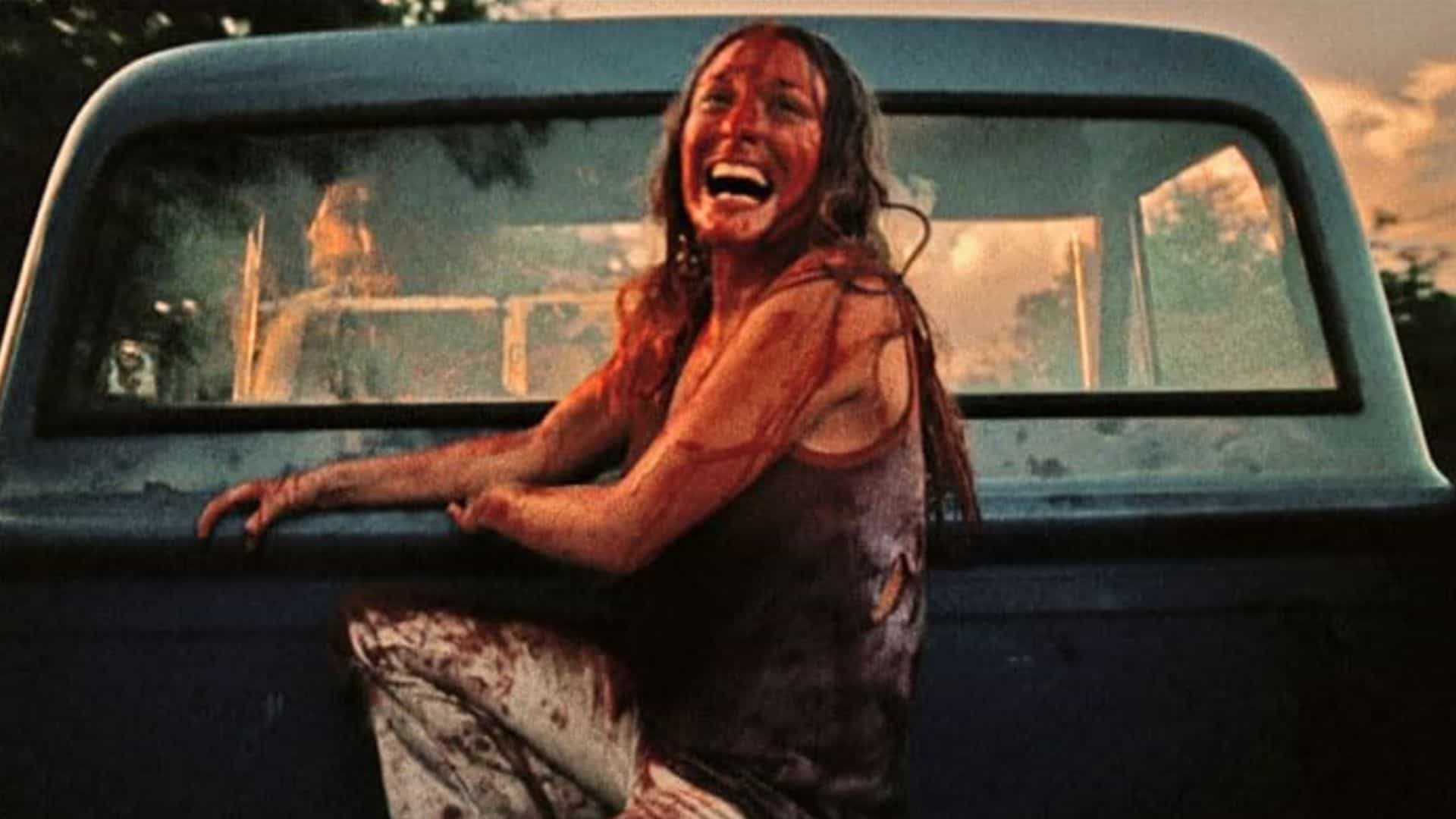 A woman is covered in blood in the bed of a pickup truck in this image from Vortex Inc.