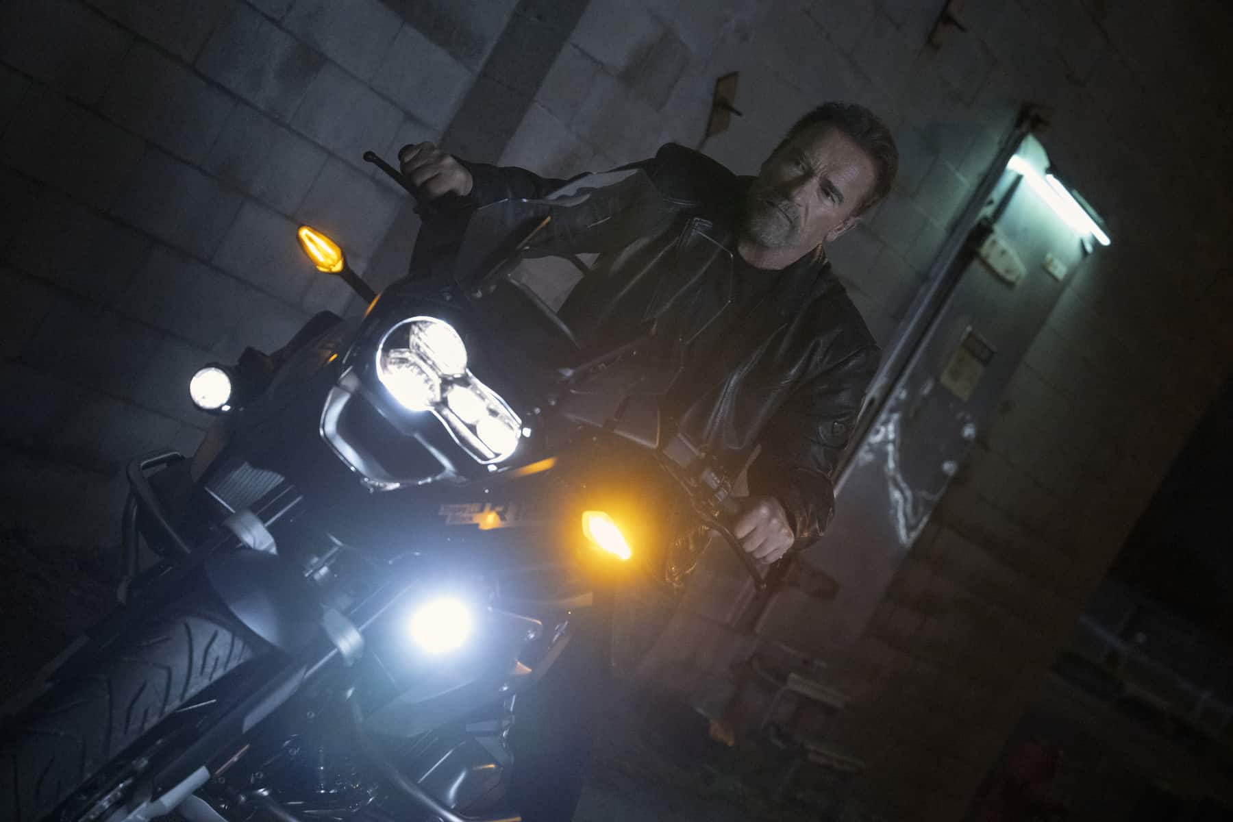 Arnold Schwarzenegger rides a motorcycle in this image from Blackjack Films Inc.