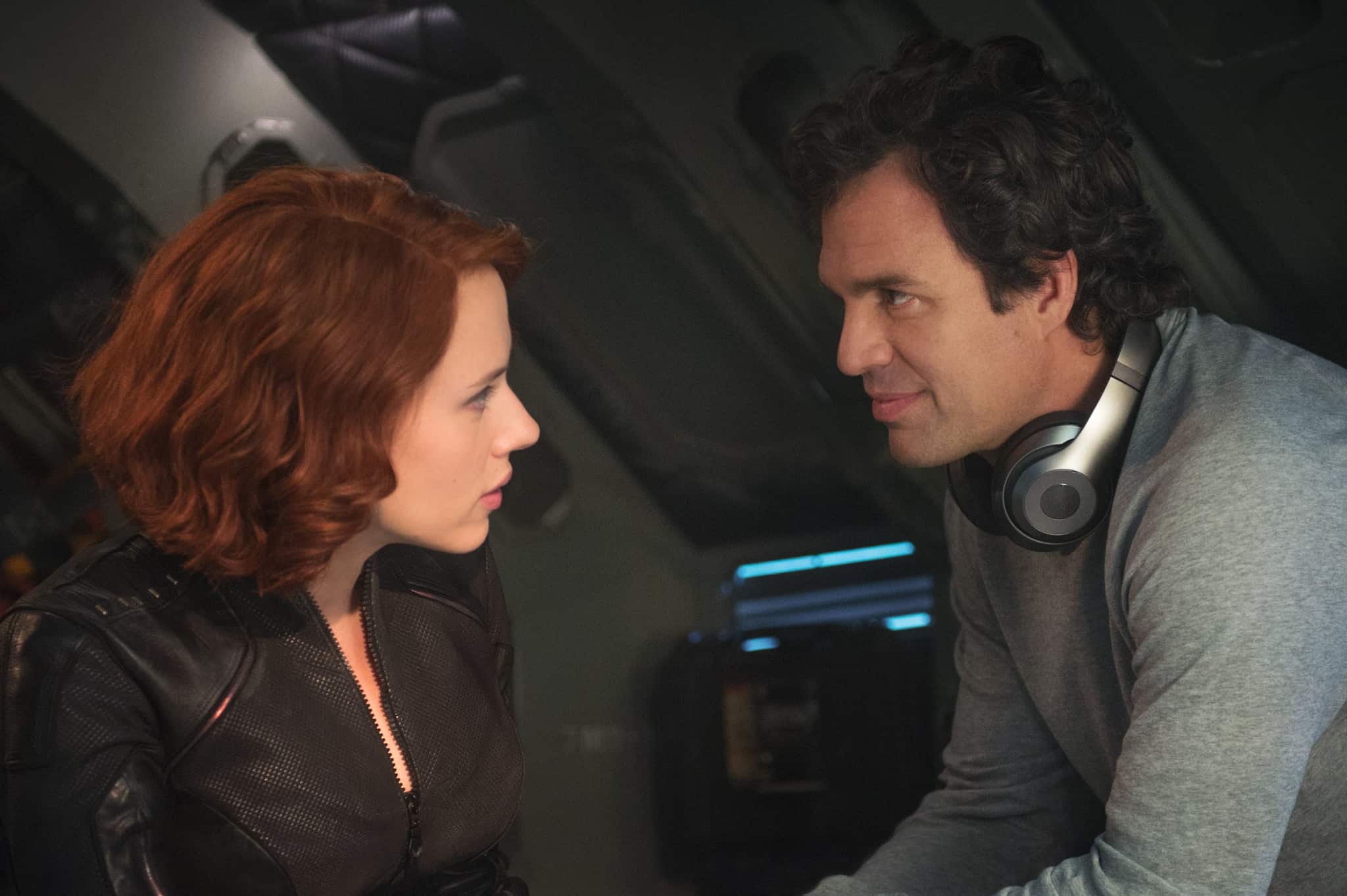 A woman and a man talking inside headquarters in this photo from Marvel Studios