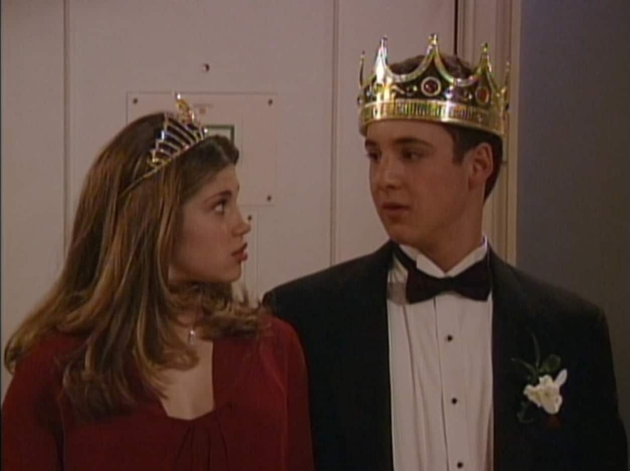A teen couple wearing crowns stares at each other in this image from Touchstone Pictures.