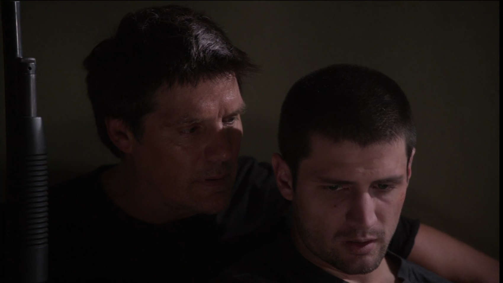 A father holds his distressed adult son in this image from Tollin/Robbins Productions.