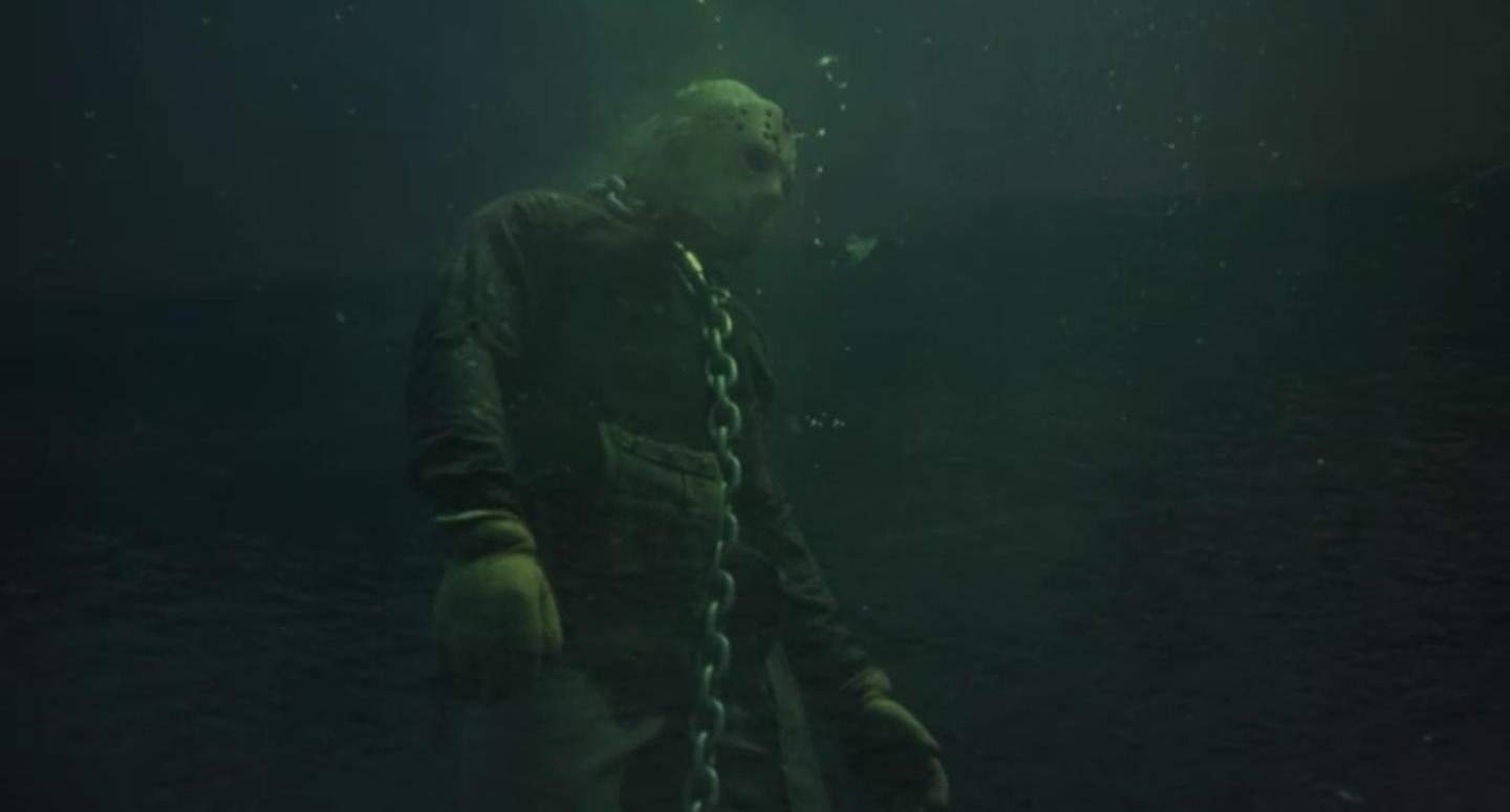 A man in a hockey mask chained underwater in this photo from Terror Inc. 