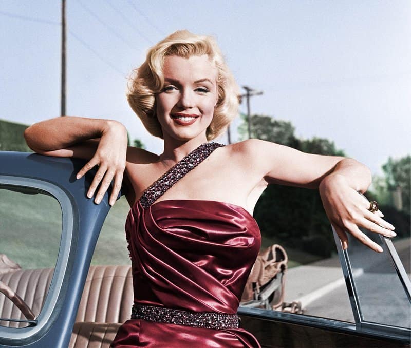 Marilyn Monroe poses in a car in this image from 20th Century Fox.
