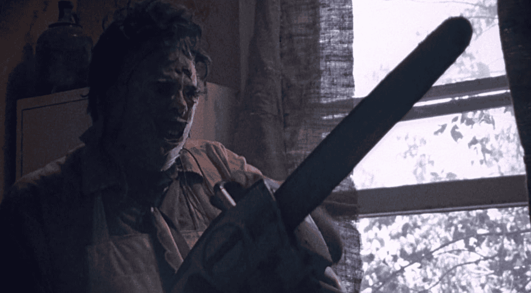 A masked man holds a chainsaw in this image from Vortex Inc.