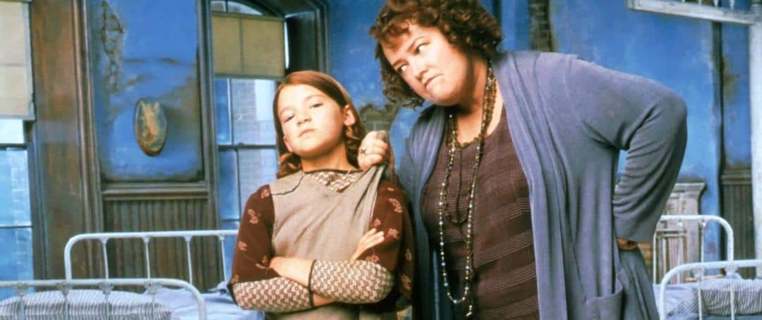 Kathy Bates grabs Alicia Morton by the collar in this image from Walt Disney Television.