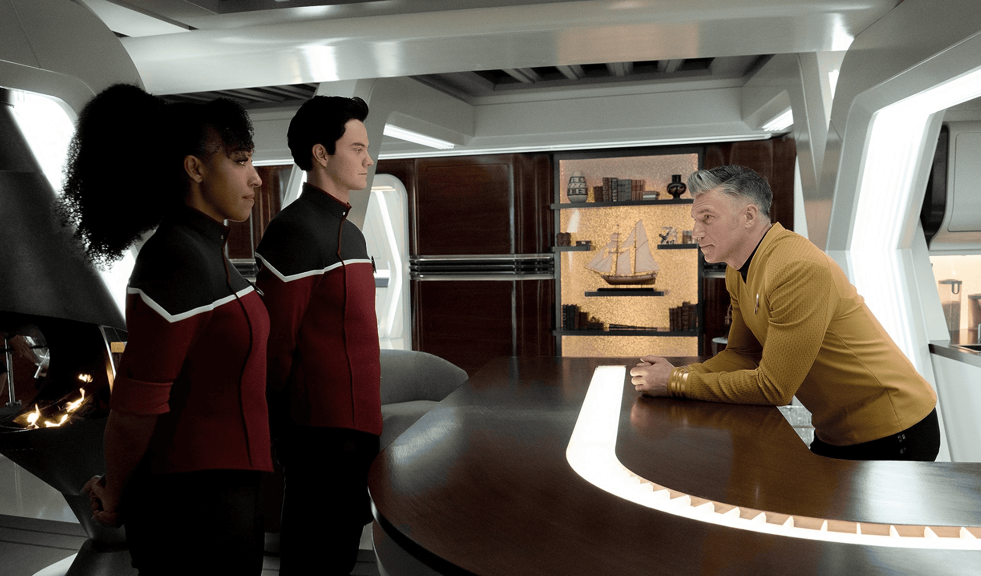  A pair of members of a spaceship get talked to by the ship's captain in this image from CBS Studios.