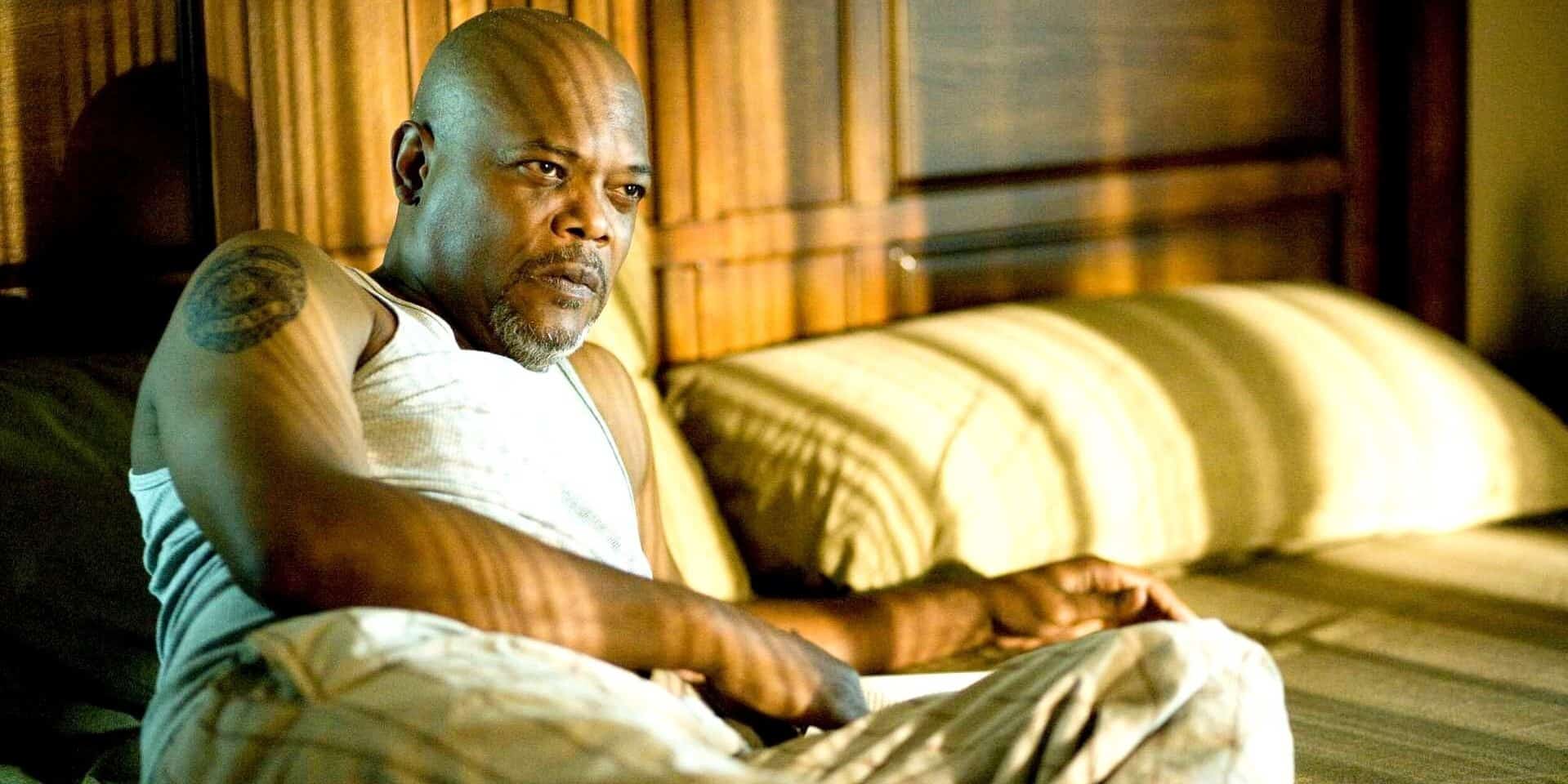 Samuel L. Jackson flips through the TV with a remote in this image from Screen Gems.