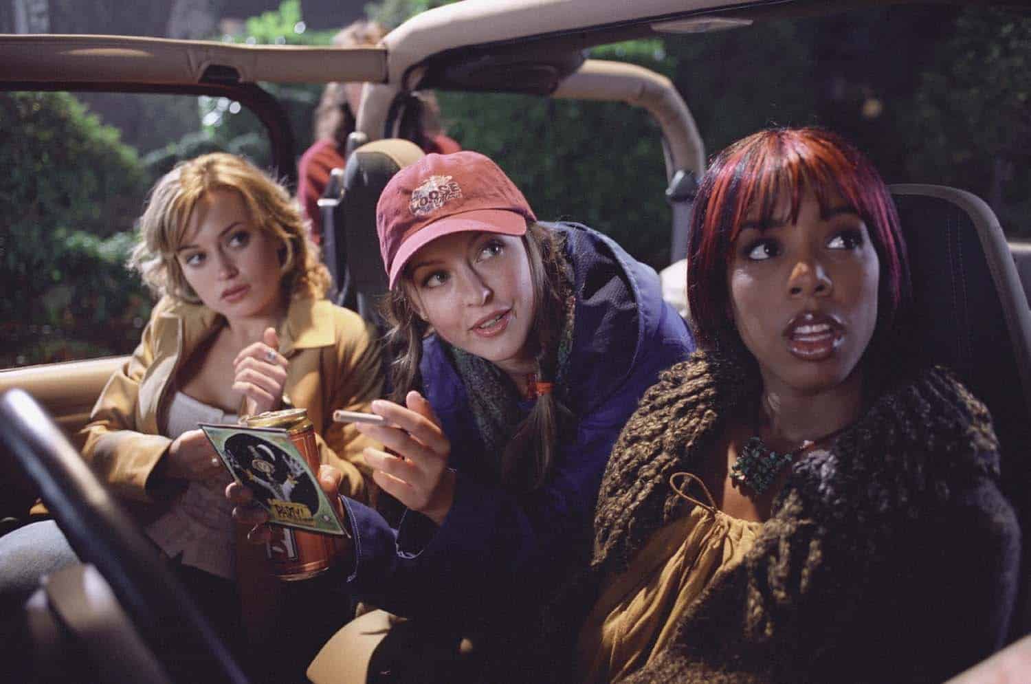 Three girls looking snarky in a Jeep in this photo from New Line Cinema