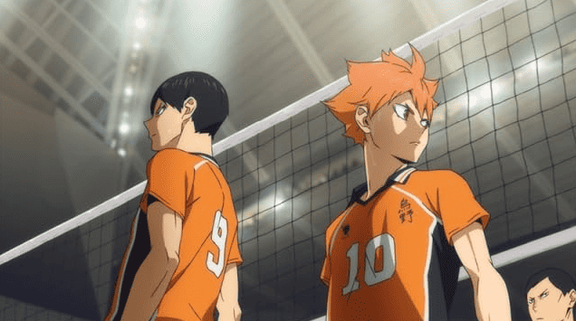 Two boys stand in front of a volleyball net in this image from Production I.G. 