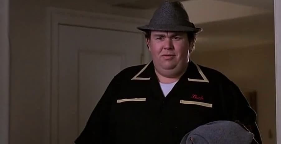 John Candy wearing a fedora in this image from Hughes Entertainment