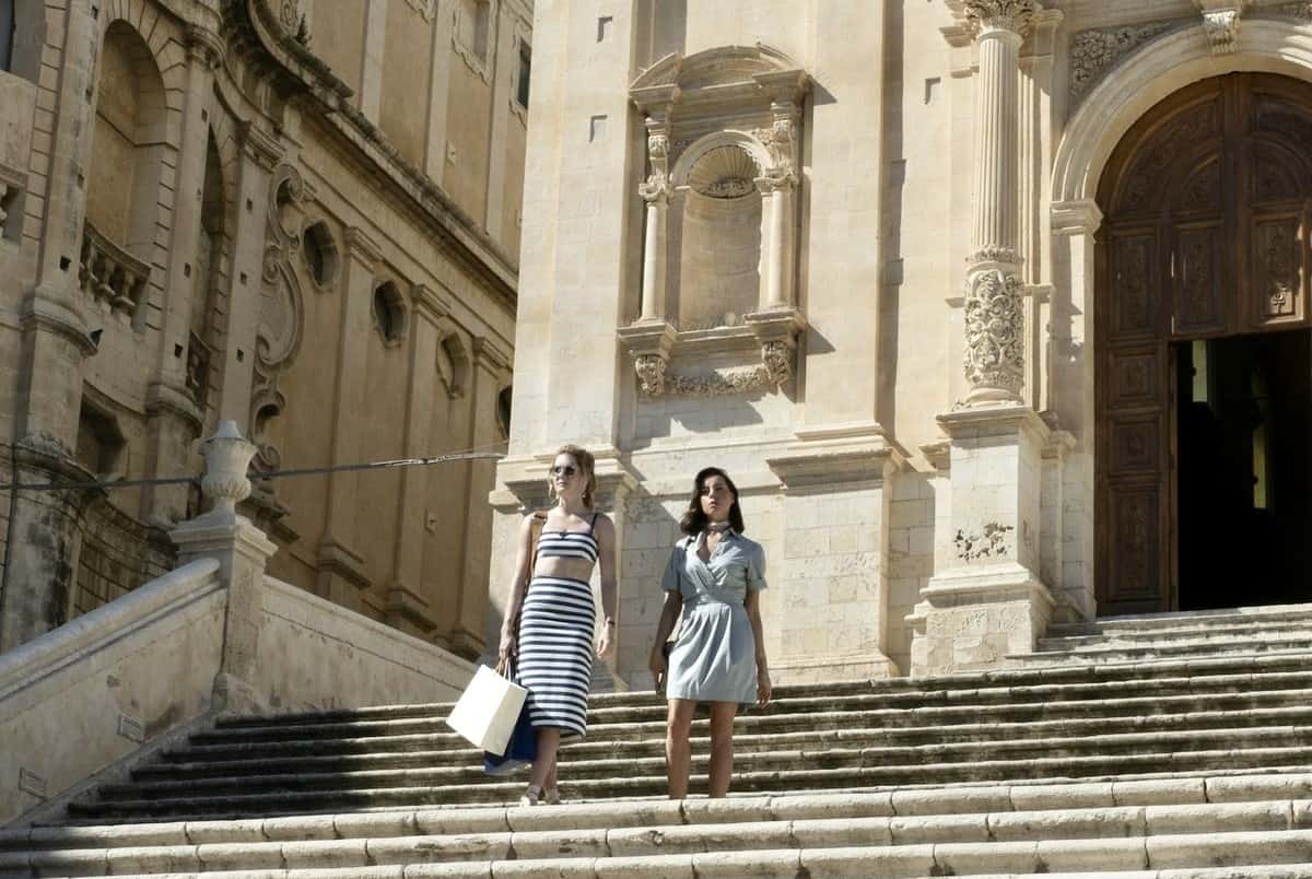 Two women walk down stairs in this photo from Rip Cord Productions.