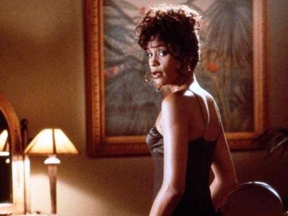 Whitney Houston in a slinky black nightdress in this image from Twentieth Century Fox