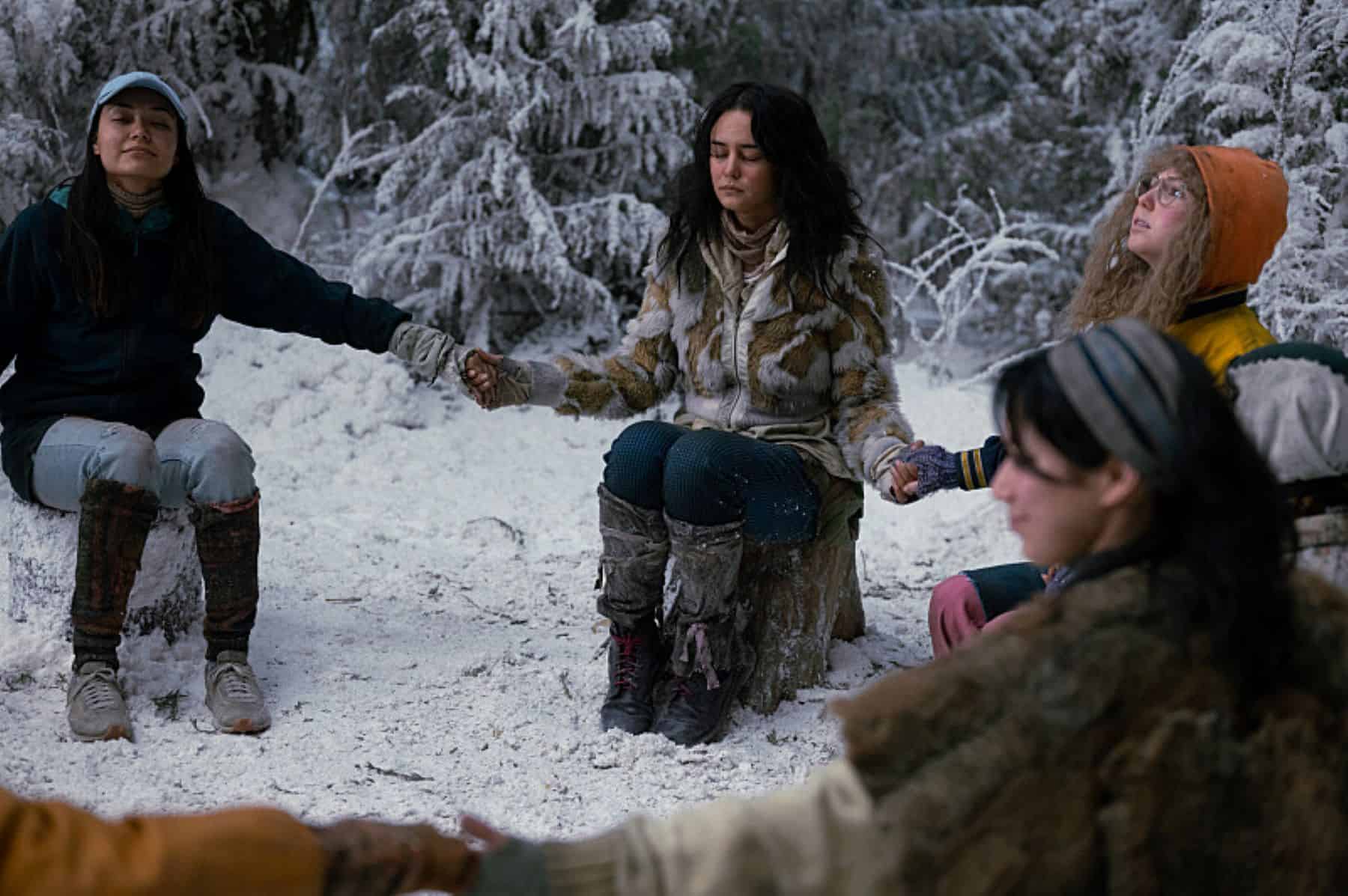  A group of girls sit in a circle holding hands in this photo by Showtime.