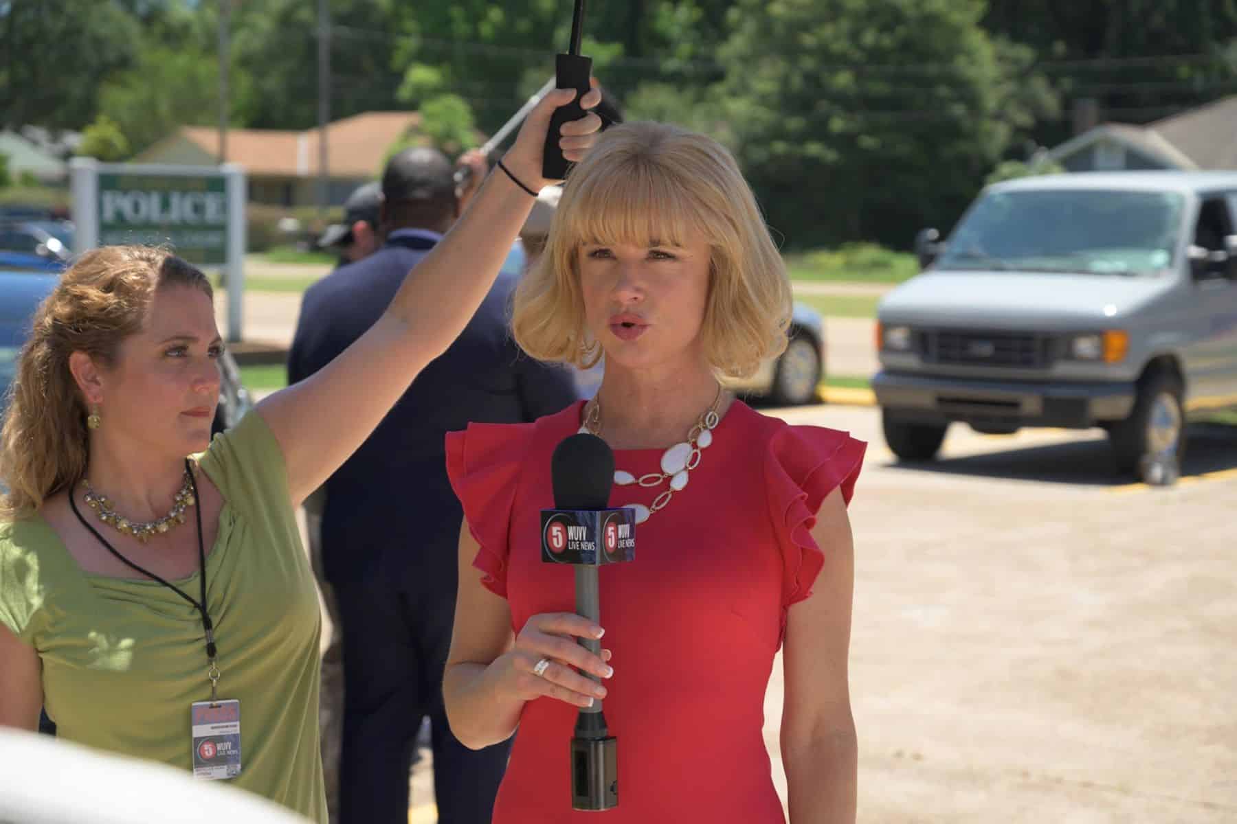 A female reporter holds a microphone in this image from American International Pictures.
