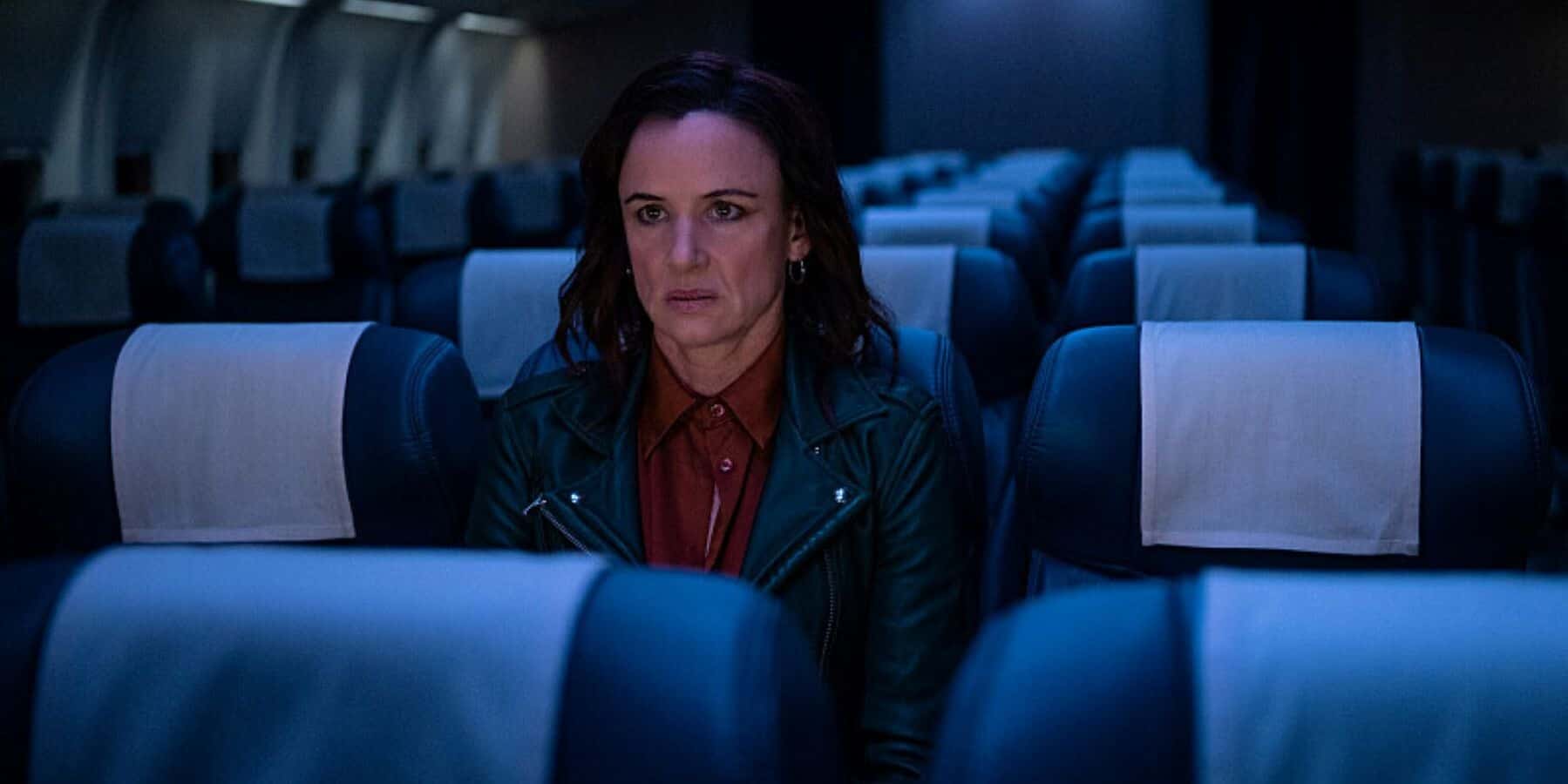 A woman sits on an empty airplane in this photo by Showtime Networks.