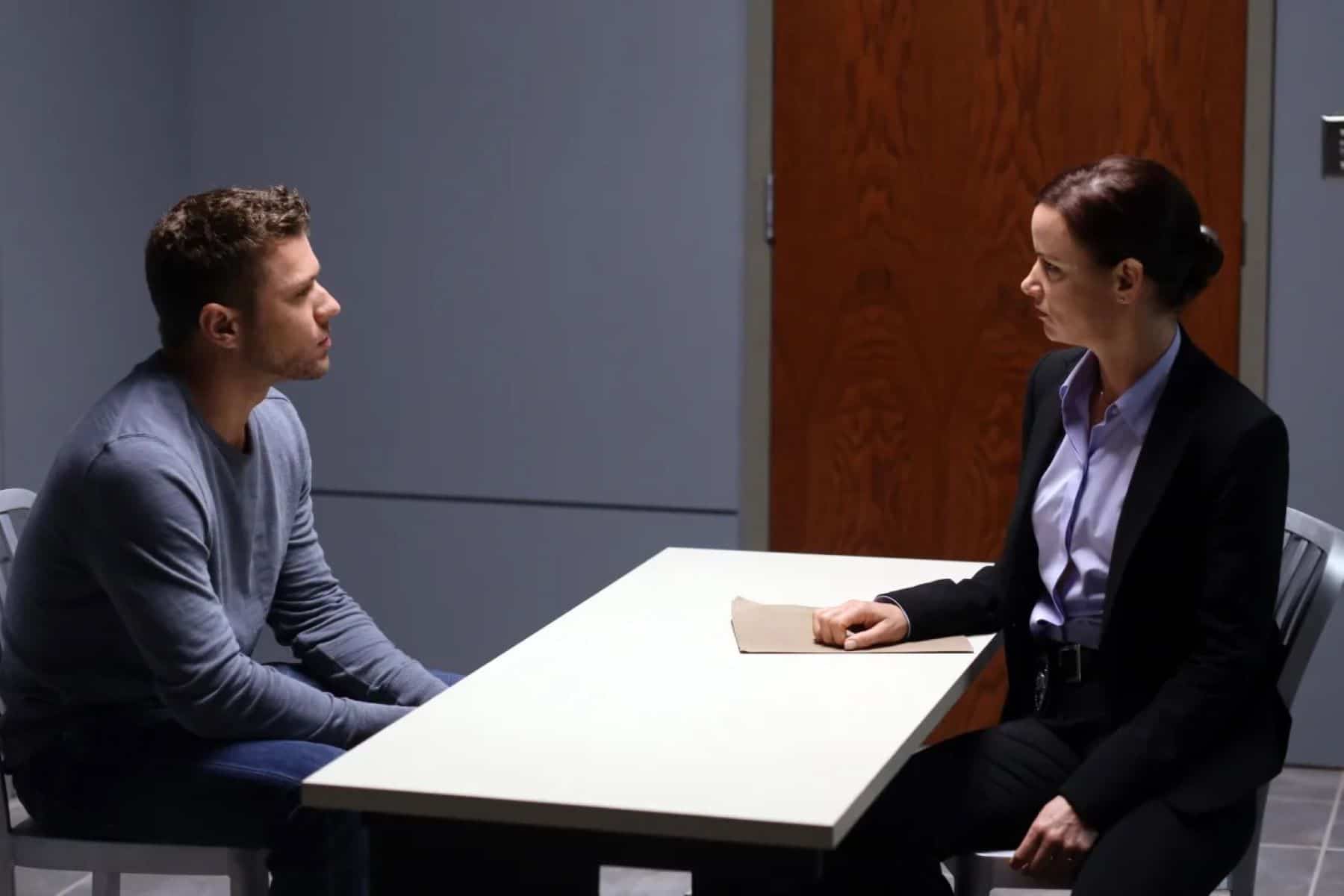 A female detective sits across from a male suspect in a police interrogation room in this image from ABC Studios.