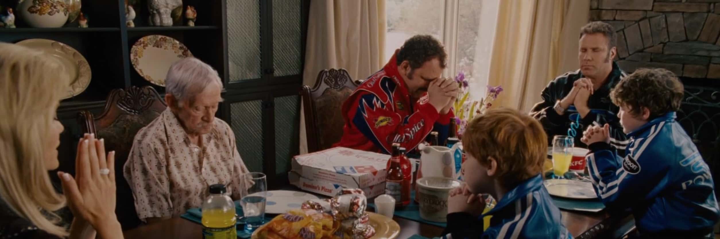 A family sits at a table filled with various fast-food items in this image from Columbia Pictures.