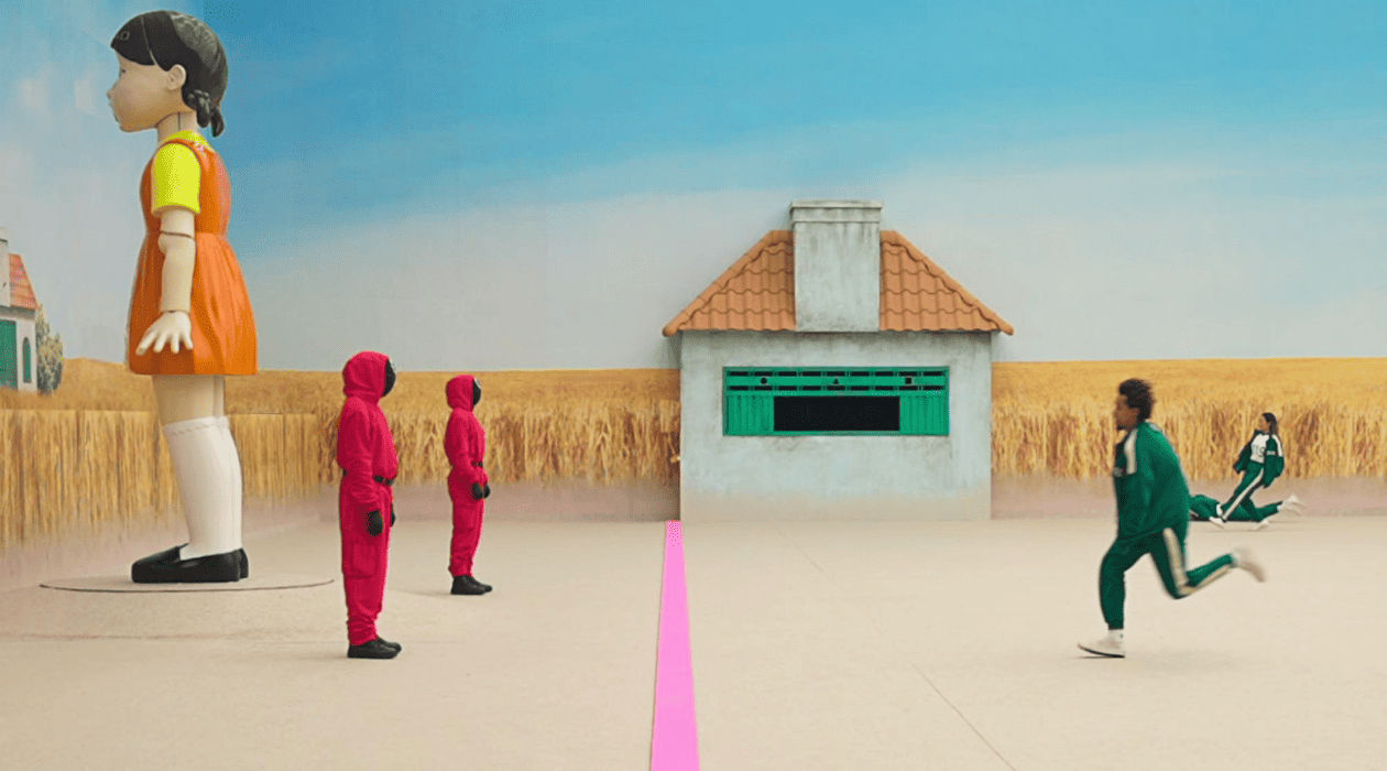 People in tracksuits run toward a finish line in this image by Studio Lambert.