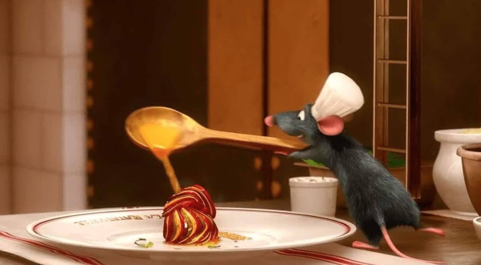 An animated rat pours sauce onto a plate in this image from Pixar Animation Studios.