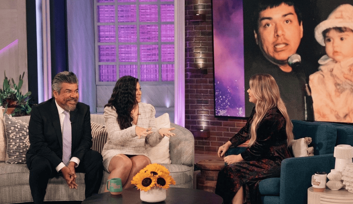 A couple sitting next to a woman while on the set of her show in this image from NBCUniversal.