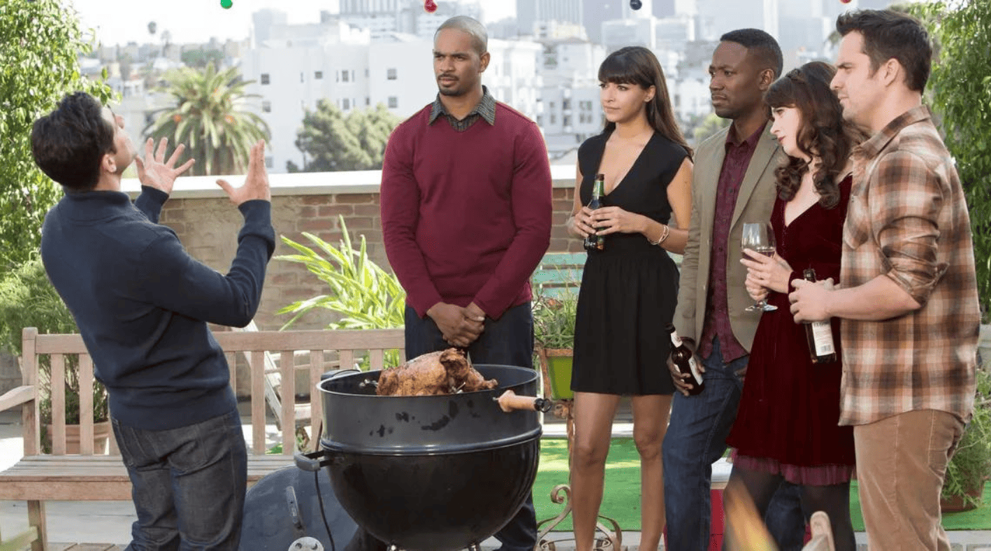 A man preaches to his group of friends on a rooftop in this image from Elizabeth Meriwether Pictures.