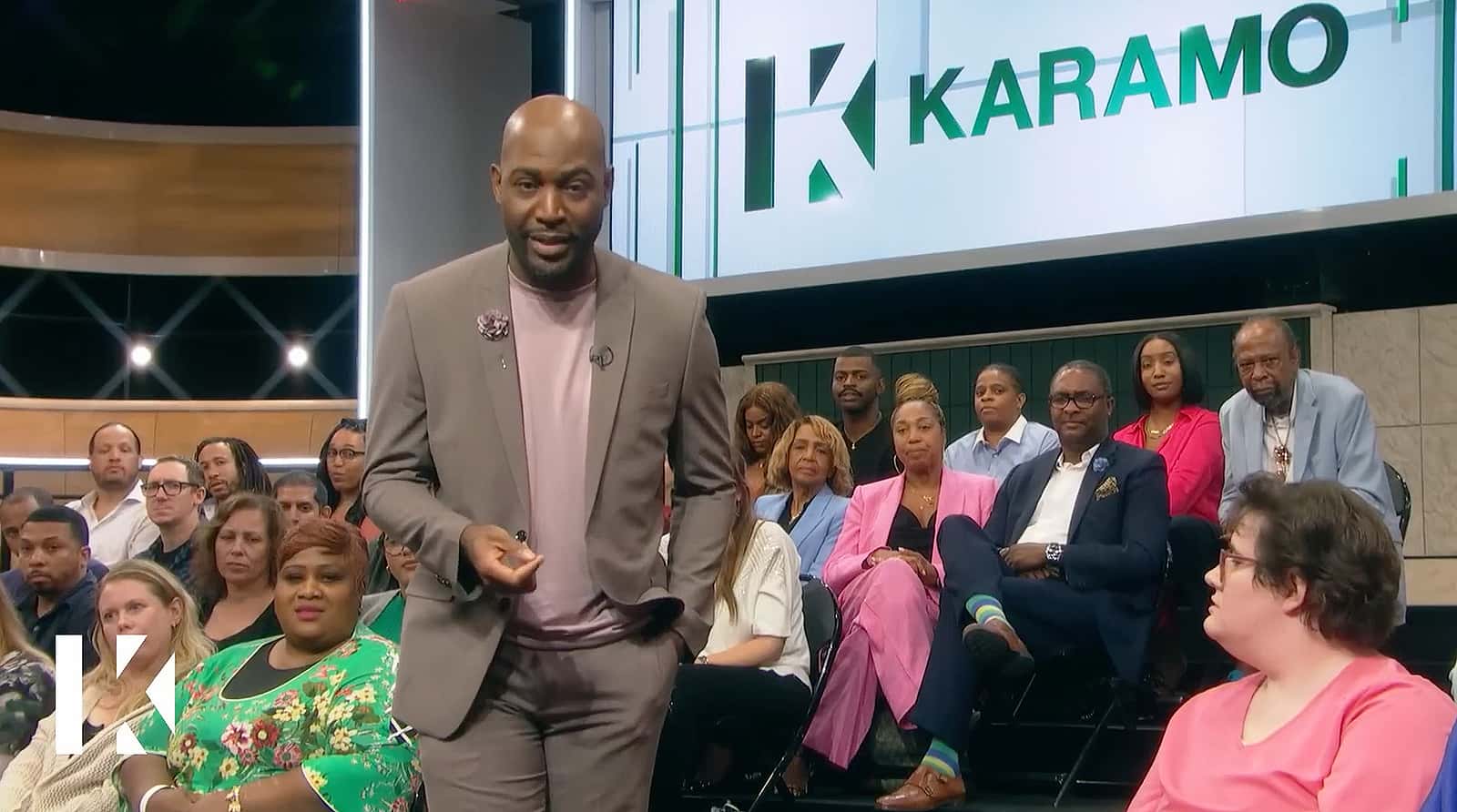 A man stands among the audience in this image from Stamford Studios.