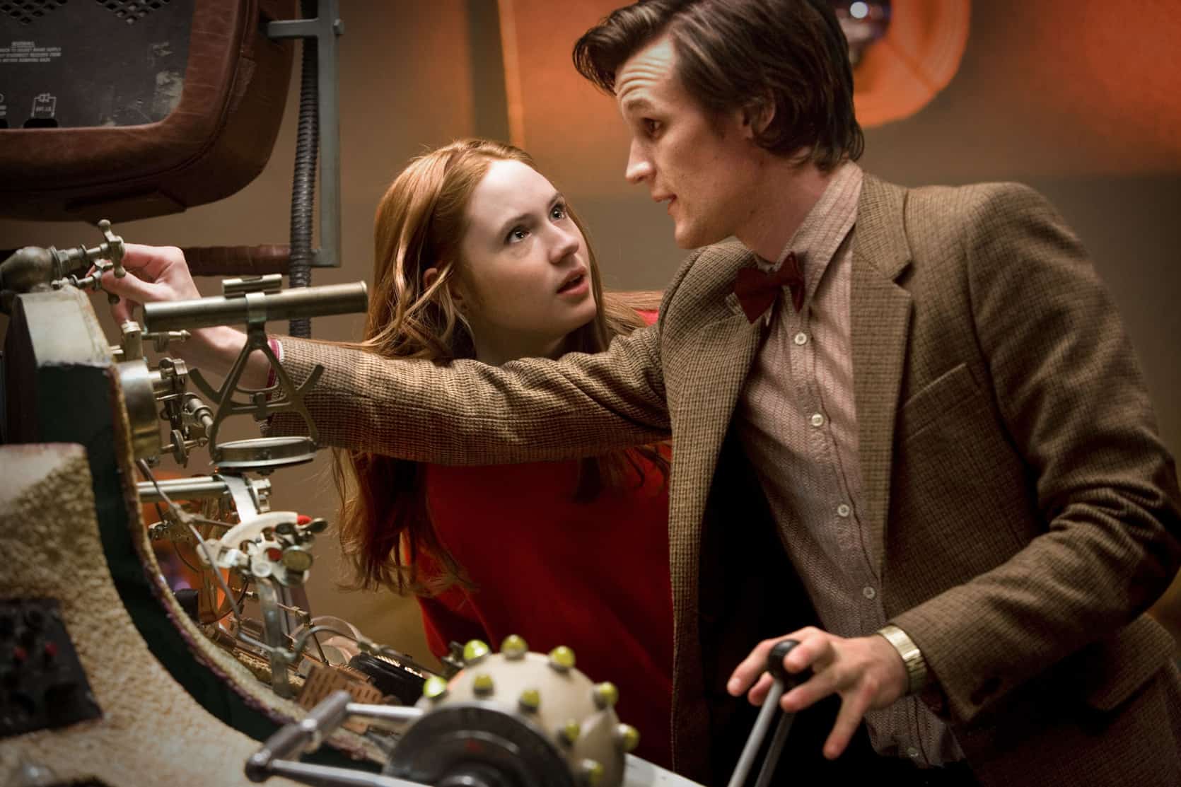 A man and a woman tinkering with the TARDIS in this photo from British Broadcasting Corporation.