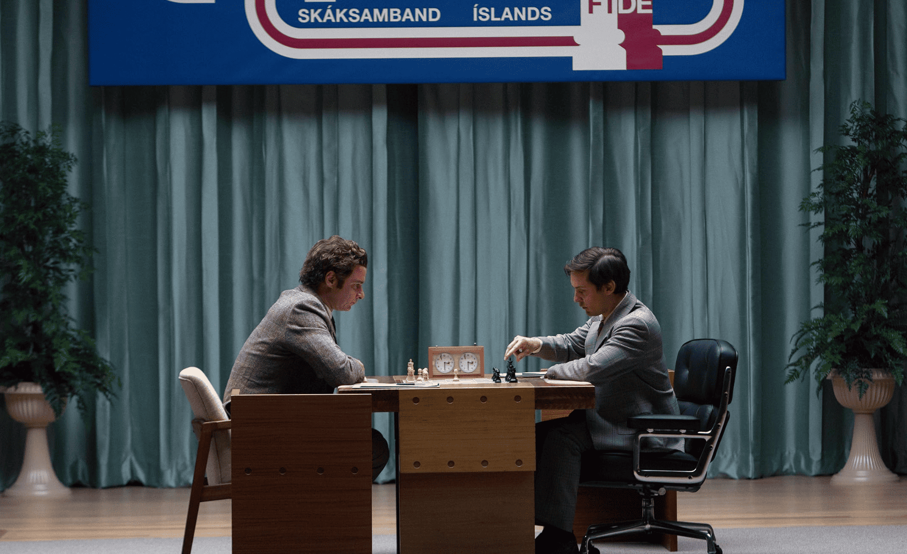 Two men play chess in this image from Gail Katz Productions. 